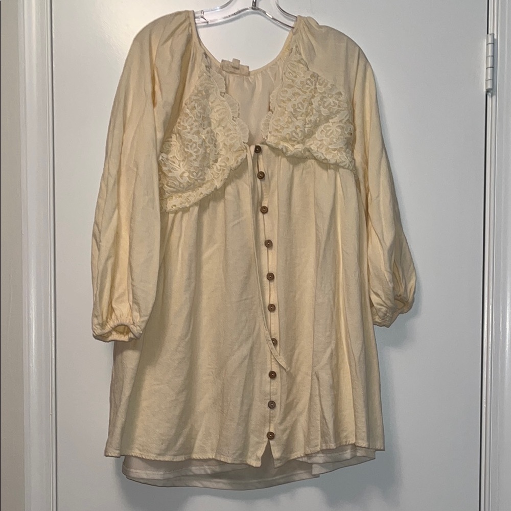 Listicle Cream Top with Subtle Embroidered Logo